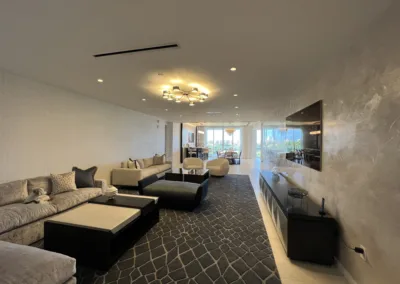 A living room with couches and a flat screen tv.