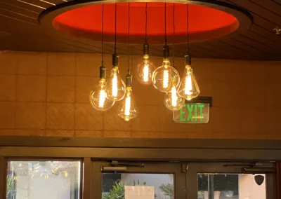 A circular light fixture hangs over a doorway.
