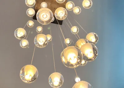 A chandelier with a lot of glass balls hanging from it.