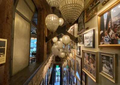 A person is walking down the stairs in a restaurant.